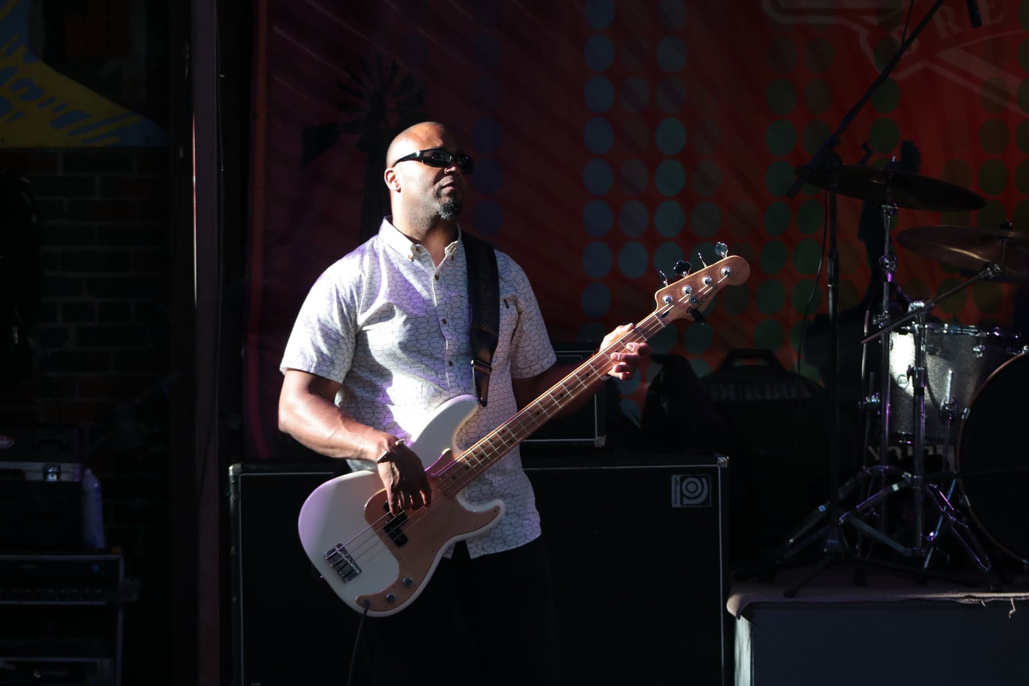 Wide stage view of The James Pitts Band performing live.